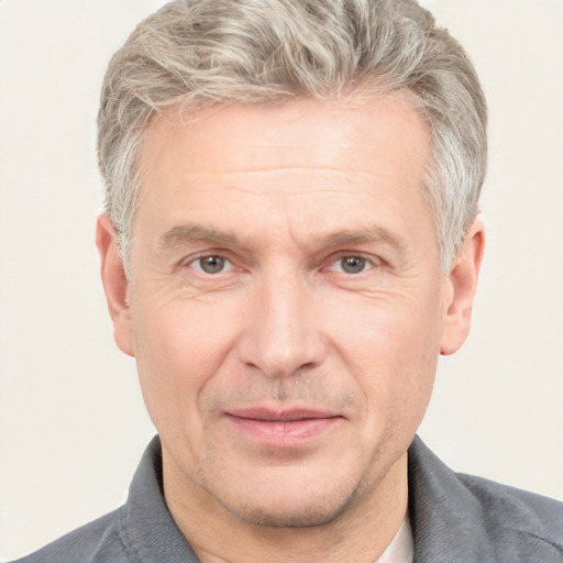 Joyful white middle-aged male with short  brown hair and grey eyes