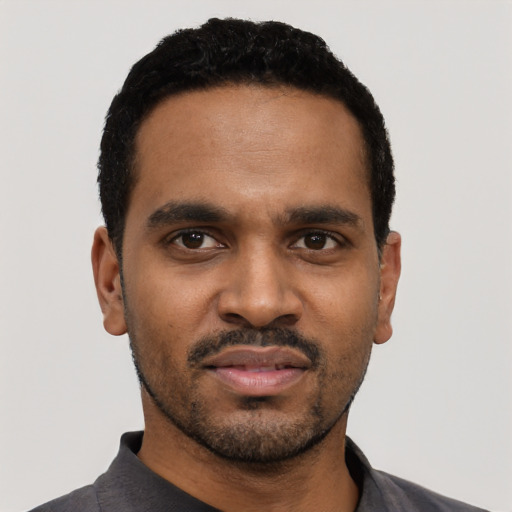 Neutral black young-adult male with short  black hair and brown eyes