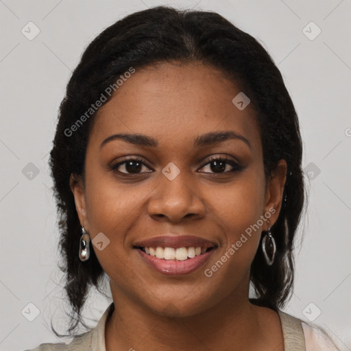 Joyful black young-adult female with long  brown hair and brown eyes