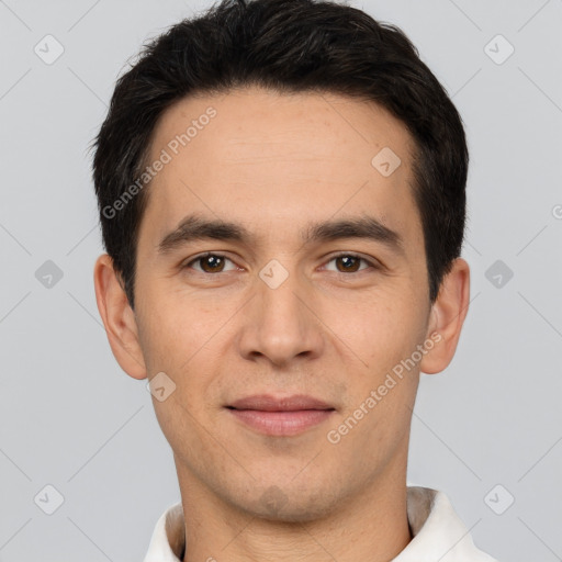 Joyful white young-adult male with short  black hair and brown eyes