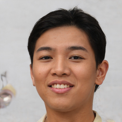Joyful asian young-adult female with short  brown hair and brown eyes