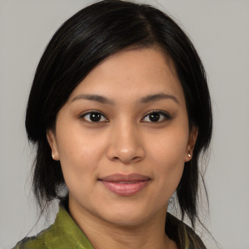 Joyful white young-adult female with medium  black hair and brown eyes