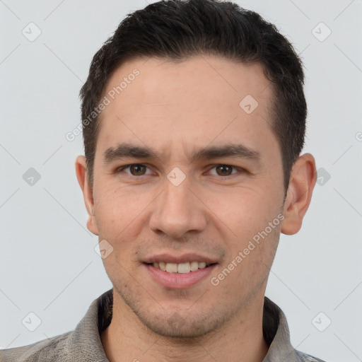 Joyful white young-adult male with short  brown hair and brown eyes