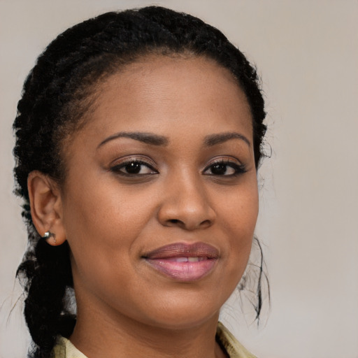 Joyful black young-adult female with medium  brown hair and brown eyes