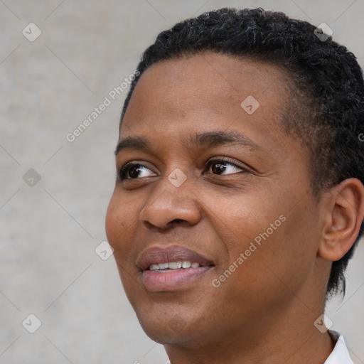 Joyful black young-adult female with short  brown hair and brown eyes