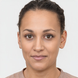 Joyful latino young-adult female with short  brown hair and brown eyes