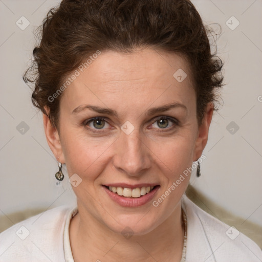 Joyful white adult female with short  brown hair and grey eyes