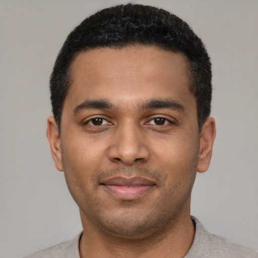 Neutral black young-adult male with short  black hair and brown eyes