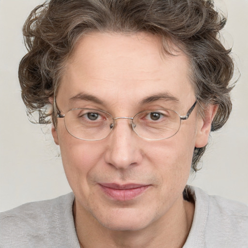 Joyful white adult male with medium  brown hair and brown eyes