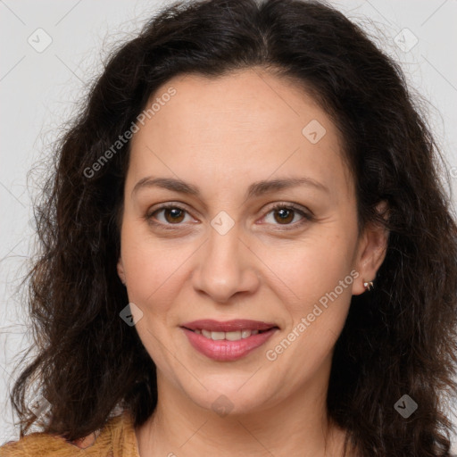 Joyful white adult female with long  brown hair and brown eyes