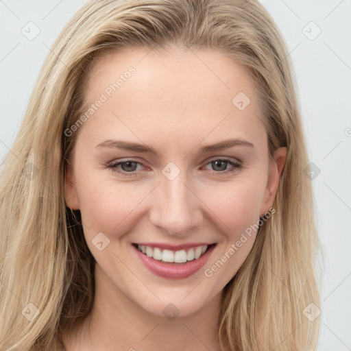 Joyful white young-adult female with long  brown hair and blue eyes