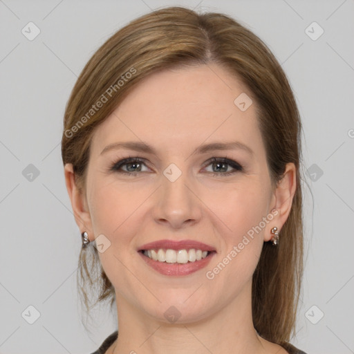 Joyful white young-adult female with medium  brown hair and grey eyes