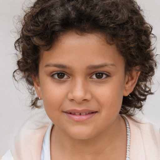 Joyful white child female with medium  brown hair and brown eyes