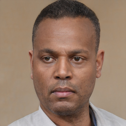 Neutral black adult male with short  black hair and brown eyes