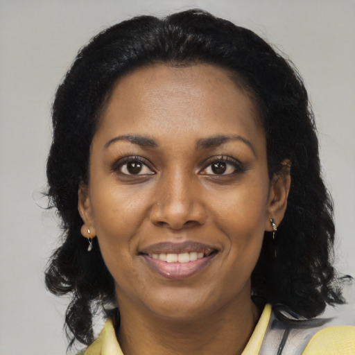 Joyful latino young-adult female with medium  black hair and brown eyes
