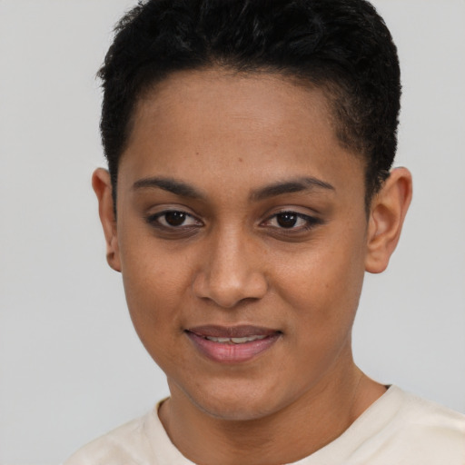 Joyful black young-adult female with short  brown hair and brown eyes