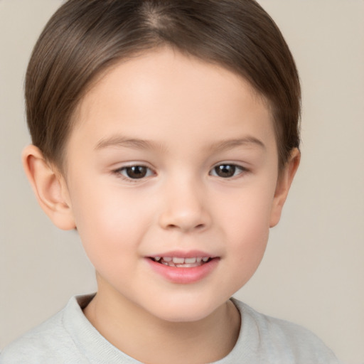 Joyful white child female with short  brown hair and brown eyes