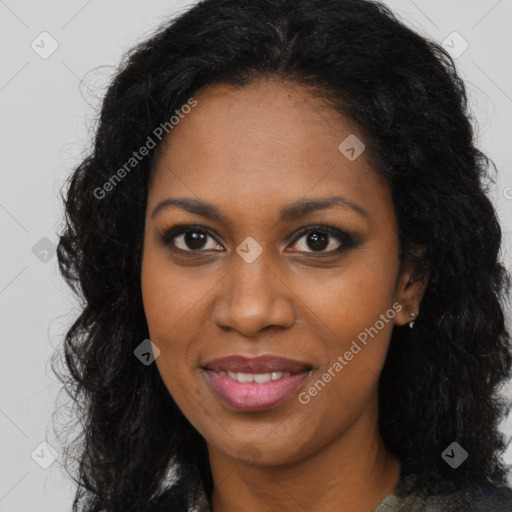 Joyful black young-adult female with long  brown hair and brown eyes