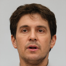 Neutral white adult male with short  brown hair and brown eyes