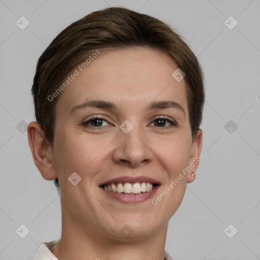 Joyful white young-adult female with short  brown hair and grey eyes