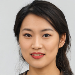 Joyful asian young-adult female with medium  black hair and brown eyes