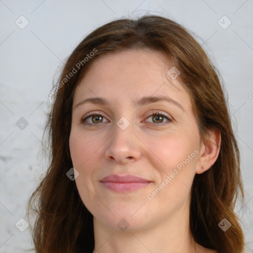 Joyful white young-adult female with long  brown hair and green eyes