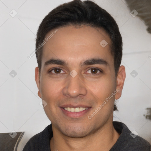 Joyful white young-adult male with short  black hair and brown eyes