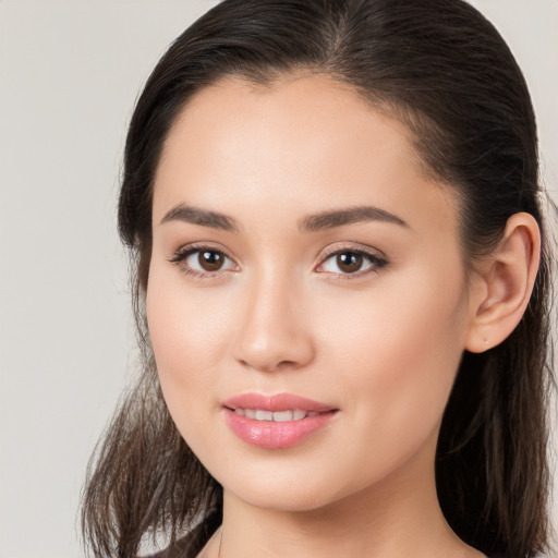 Joyful white young-adult female with long  brown hair and brown eyes