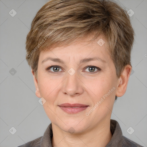 Joyful white adult female with short  brown hair and grey eyes