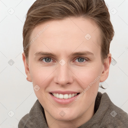 Joyful white young-adult female with short  brown hair and grey eyes