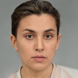 Neutral white young-adult female with short  brown hair and brown eyes