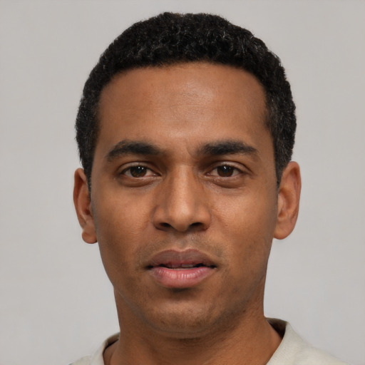 Neutral black young-adult male with short  black hair and brown eyes
