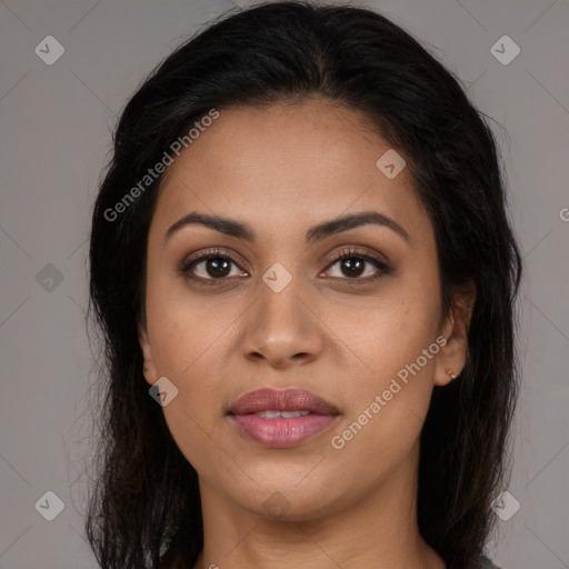 Joyful latino young-adult female with long  brown hair and brown eyes