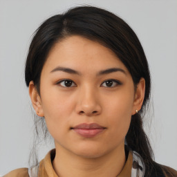 Neutral asian young-adult female with medium  brown hair and brown eyes