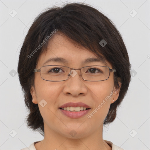 Joyful white adult female with medium  brown hair and brown eyes