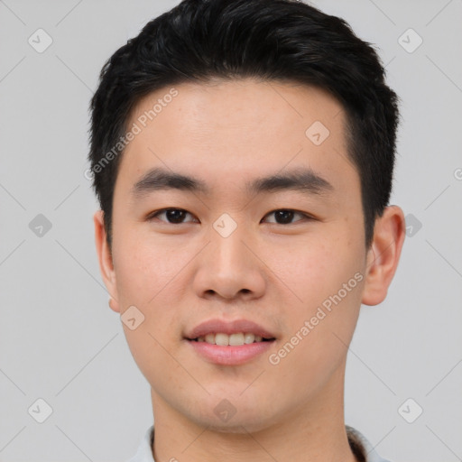 Joyful asian young-adult male with short  black hair and brown eyes