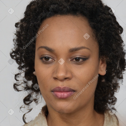 Joyful black young-adult female with long  brown hair and brown eyes