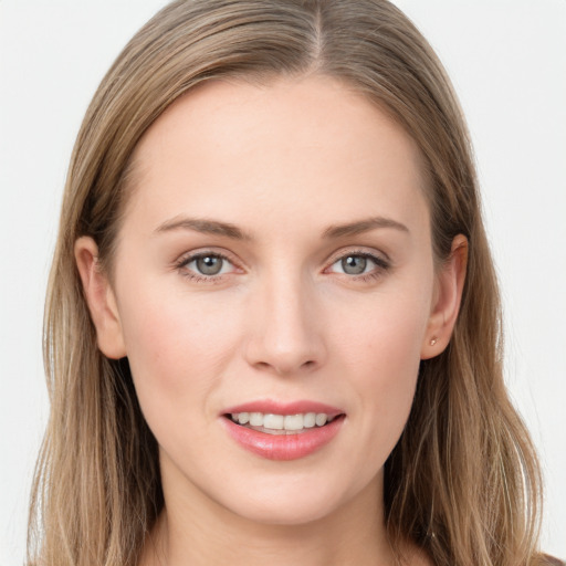 Joyful white young-adult female with long  brown hair and grey eyes