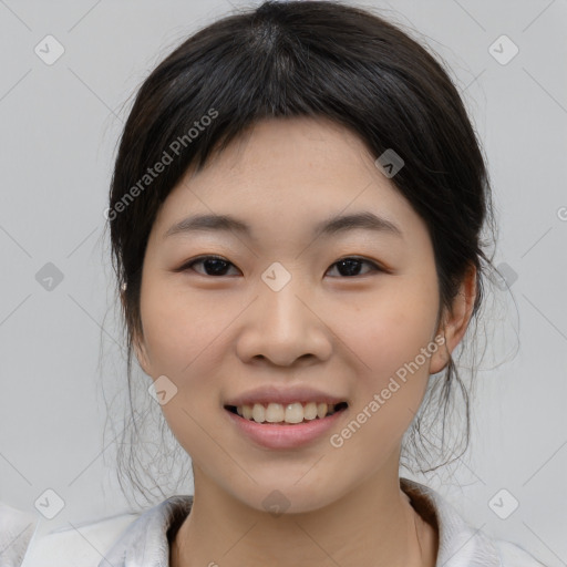 Joyful asian young-adult female with medium  black hair and brown eyes