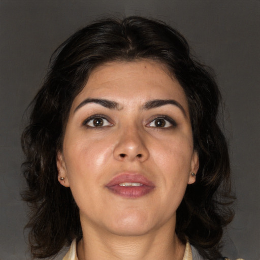 Joyful asian adult female with medium  brown hair and brown eyes
