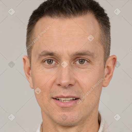 Joyful white adult male with short  brown hair and brown eyes