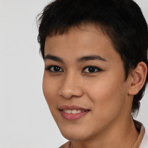 Joyful asian young-adult female with short  brown hair and brown eyes