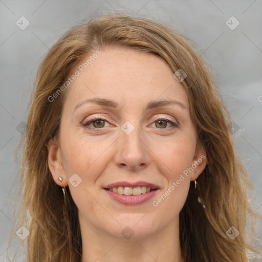 Joyful white adult female with long  brown hair and brown eyes