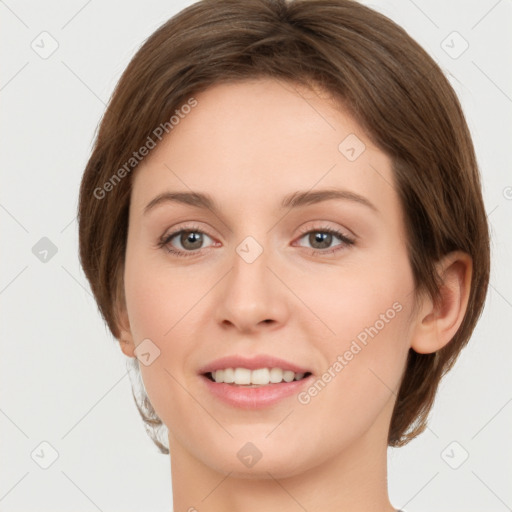 Joyful white young-adult female with medium  brown hair and green eyes