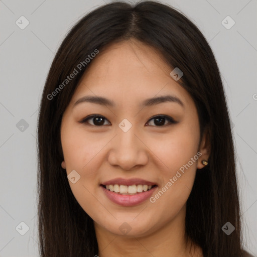 Joyful asian young-adult female with long  brown hair and brown eyes