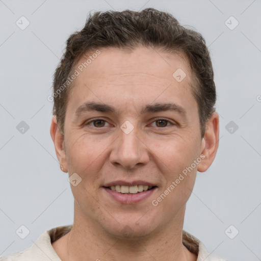 Joyful white adult male with short  brown hair and brown eyes