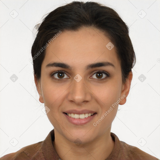 Joyful latino young-adult female with short  brown hair and brown eyes