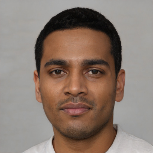 Neutral latino young-adult male with short  black hair and brown eyes