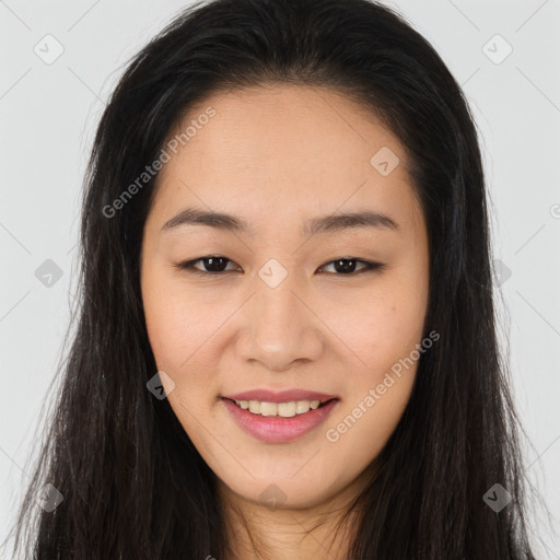 Joyful asian young-adult female with long  brown hair and brown eyes