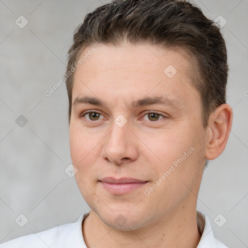 Joyful white adult male with short  brown hair and brown eyes